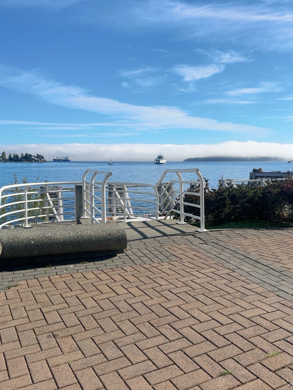 Waterfront view beneath a wide blue sky